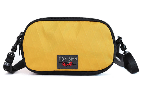 The Bantam in Sunglow X-Pac with a strap